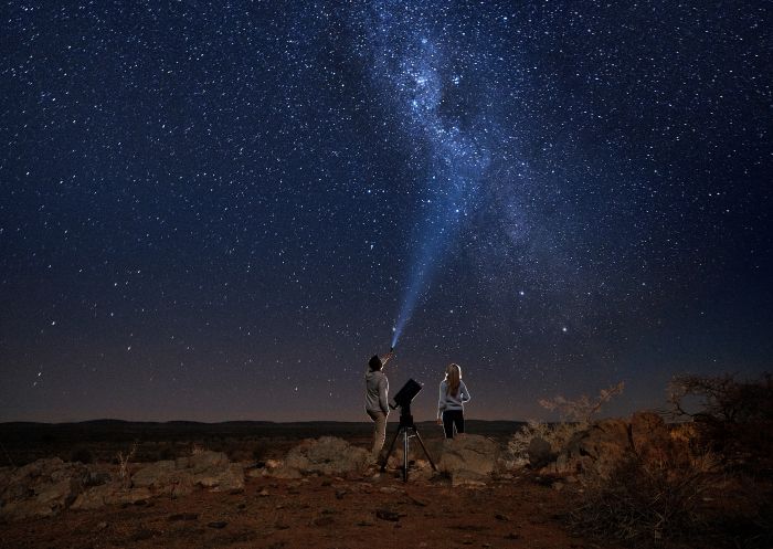 Couple star gazing beneath the Milky Way, Outback Astronomy, Broken Hill